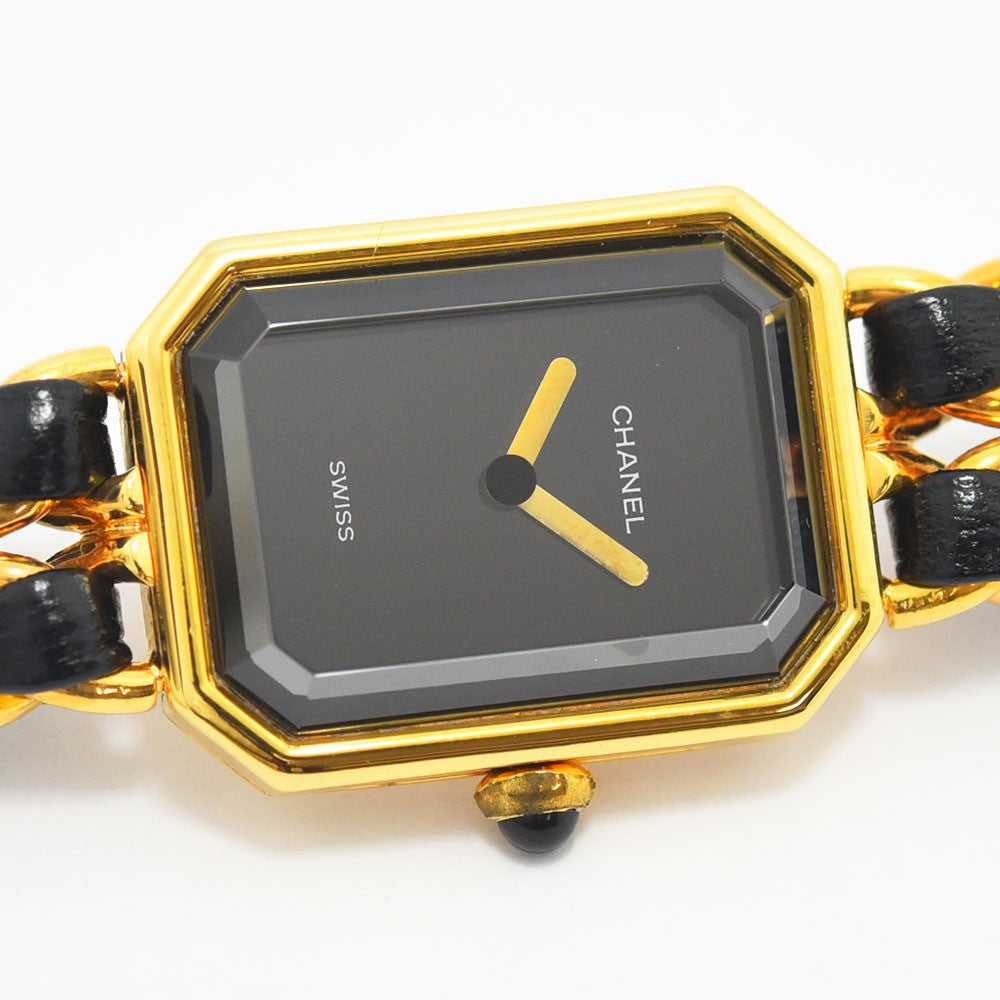 VINTAGE WATCHES FASHIONのシャネル プルミエールウォッチ。ゴールドトーンのケース、ブラックレザーチェーンストラップ、ブラックダイヤル。エレガントな八角形デザイン。