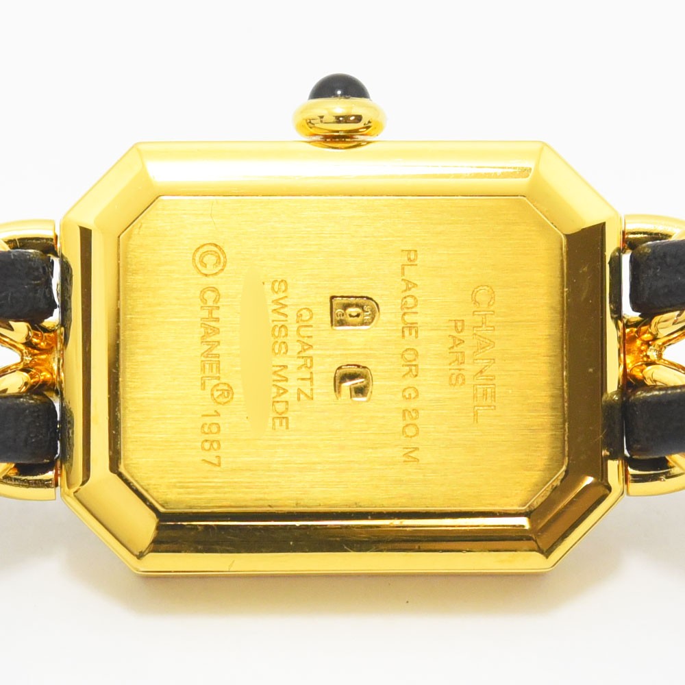 VINTAGE WATCHES FASHIONのシャネル プルミエールウォッチ。ゴールドトーンのケースとブラックレザーを編み込んだチェーンブレスレット。スイス製クオーツ。