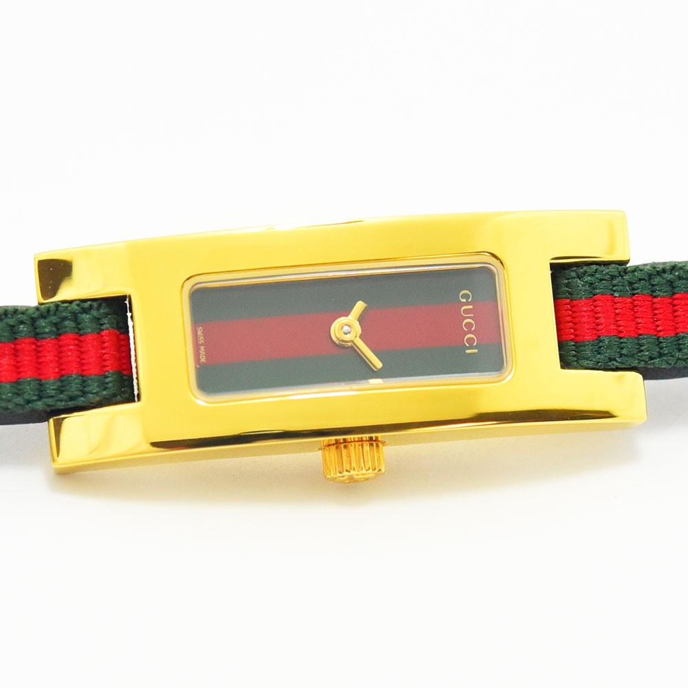VINTAGE WATCHES FASHIONのGUCCI 3900Lレディース腕時計。ゴールドの長方形ケースにウェブストライプの文字盤とストラップが特徴。