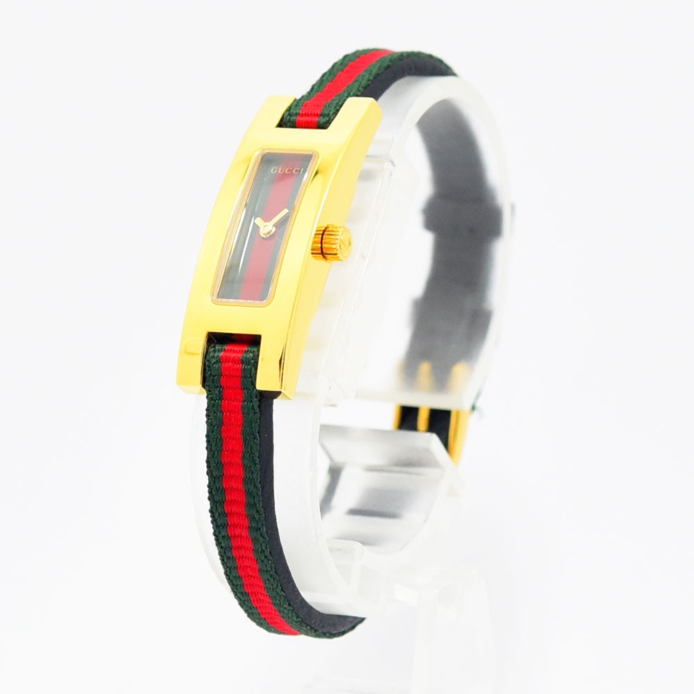 VINTAGE WATCHES FASHIONのGUCCI 3900Lレディース腕時計。ゴールドの長方形ケースとウェブストライプのテキスタイルストラップが特徴的なスイス製クォーツウォッチ。