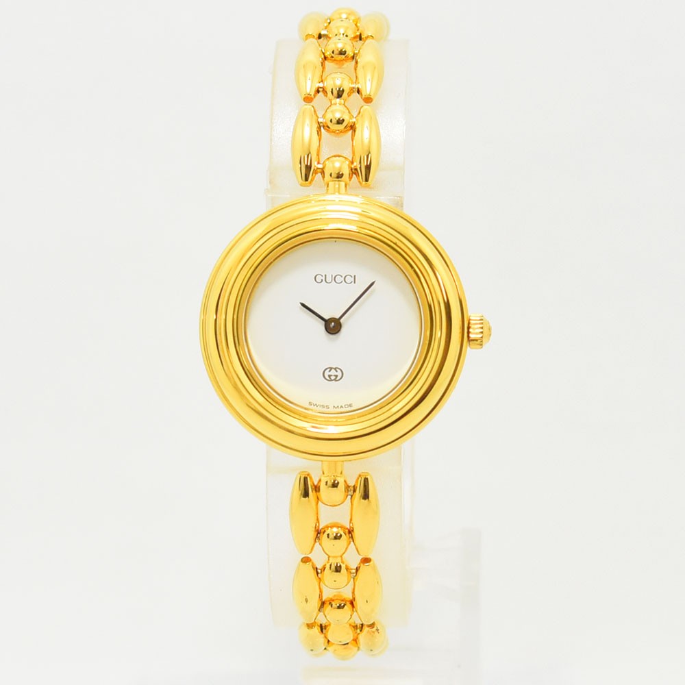 VINTAGE WATCHES FASHIONのGUCCIヴィンテージチェンジベゼルウォッチ。ゴールドトーンの華やかなブレスレットとホワイト文字盤が特徴の腕時計。