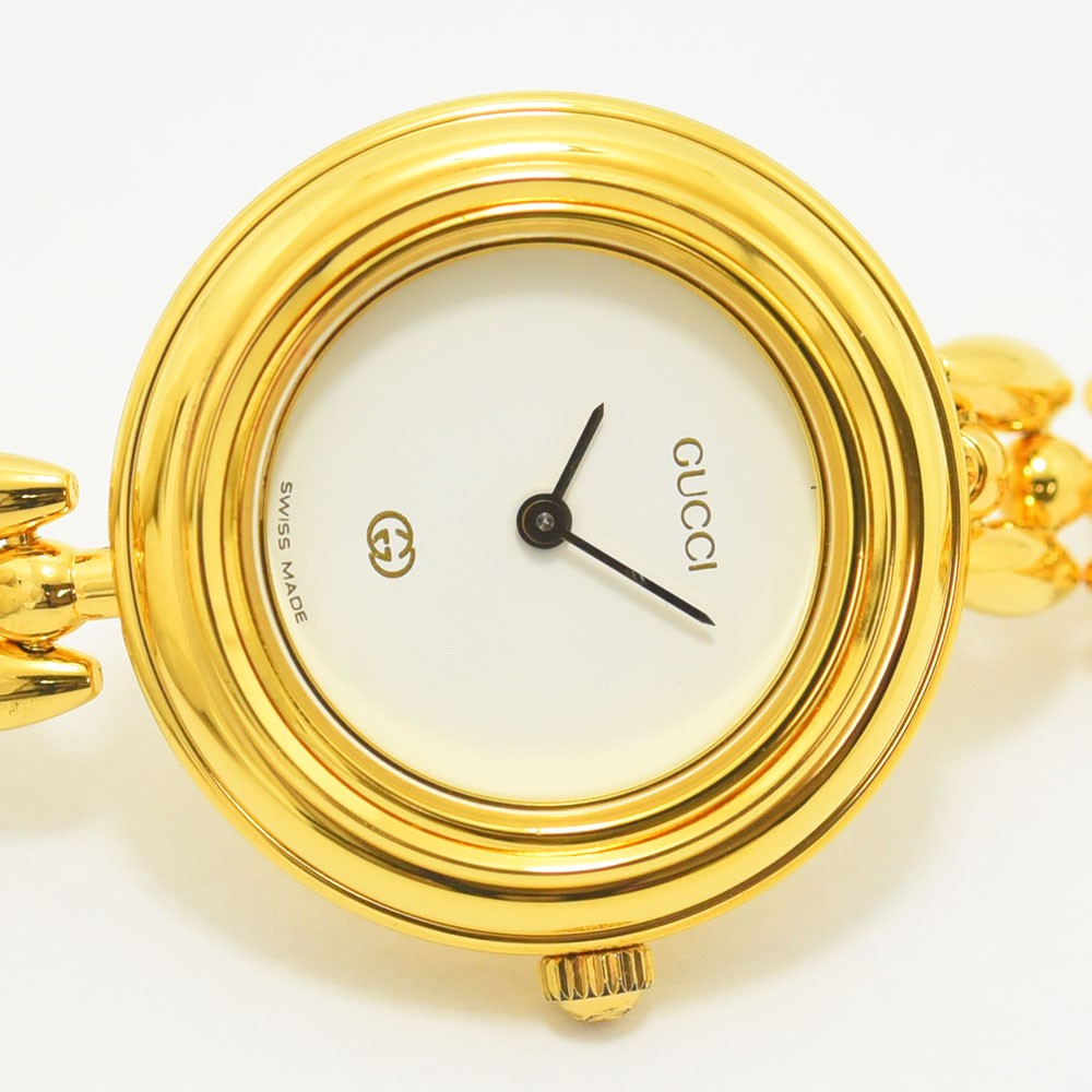 VINTAGE WATCHES FASHIONのGUCCIヴィンテージチェンジベゼルウォッチ。ゴールドトーンのケースとホワイト文字盤が特徴的なスイス製腕時計。