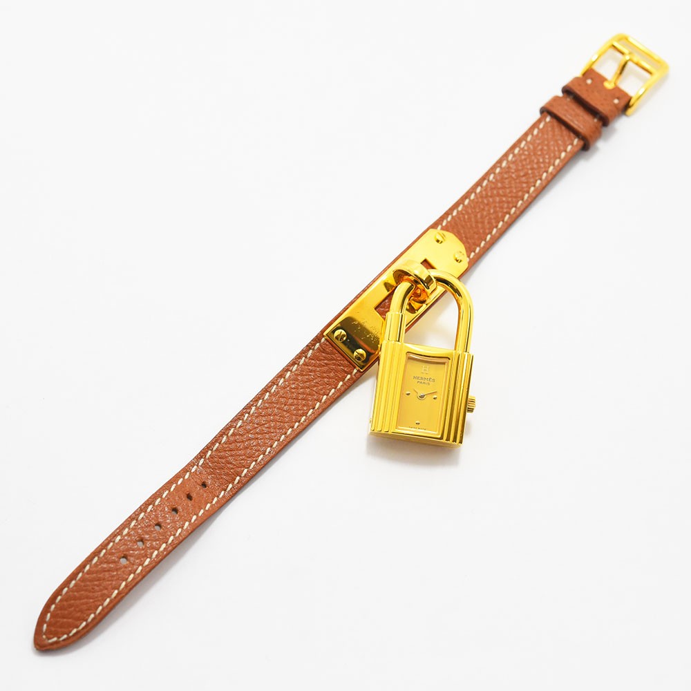 VINTAGE WATCHES FASHIONのHERMESケリーウォッチ。ゴールドの南京錠型ケースとホワイトステッチ入りブラウンレザーベルトが特徴のレディース腕時計。