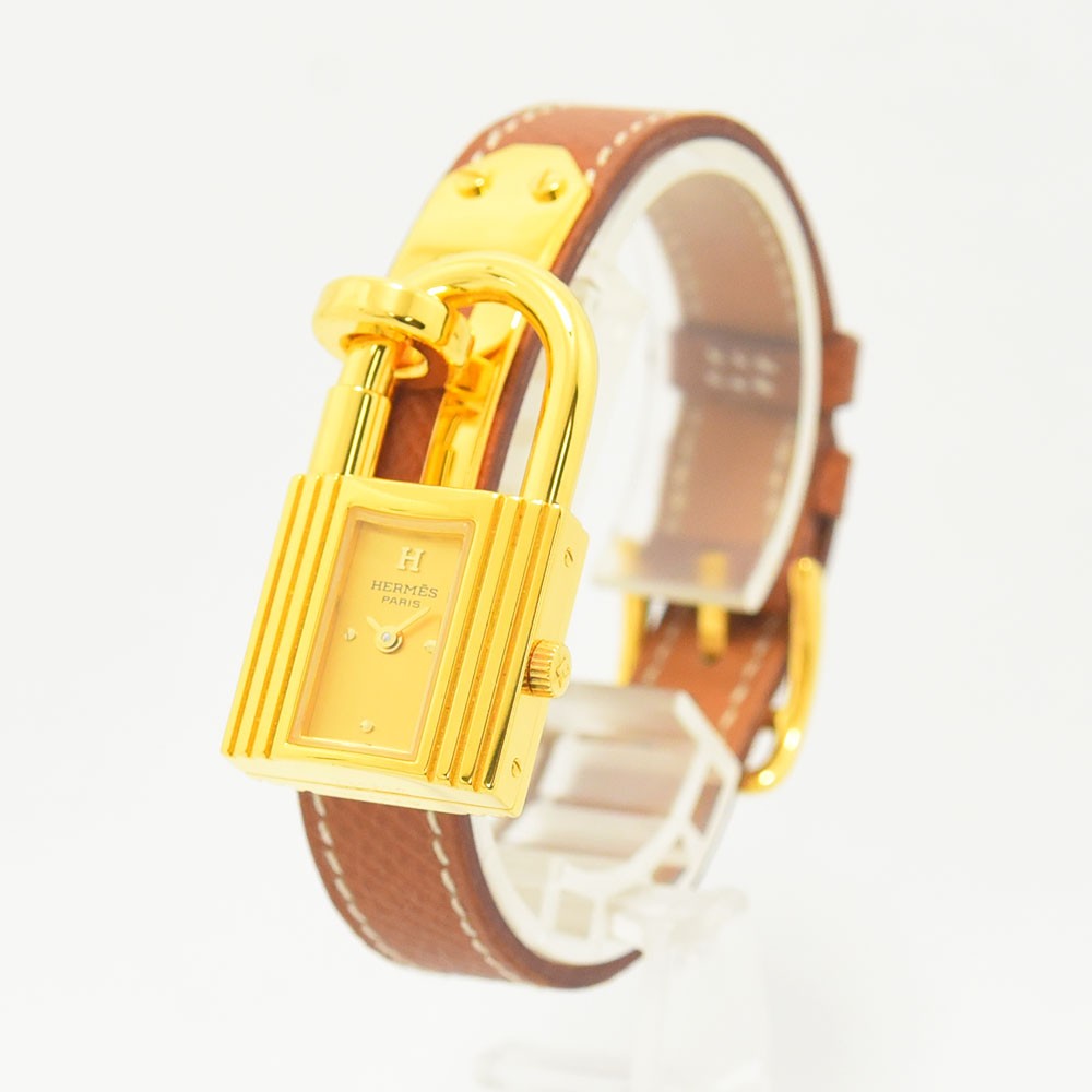 VINTAGE WATCHES FASHIONのエルメス ケリーウォッチ。ゴールドのカデナ型ケースとホワイトステッチ入りブラウンレザーベルトが特徴のレディース腕時計。