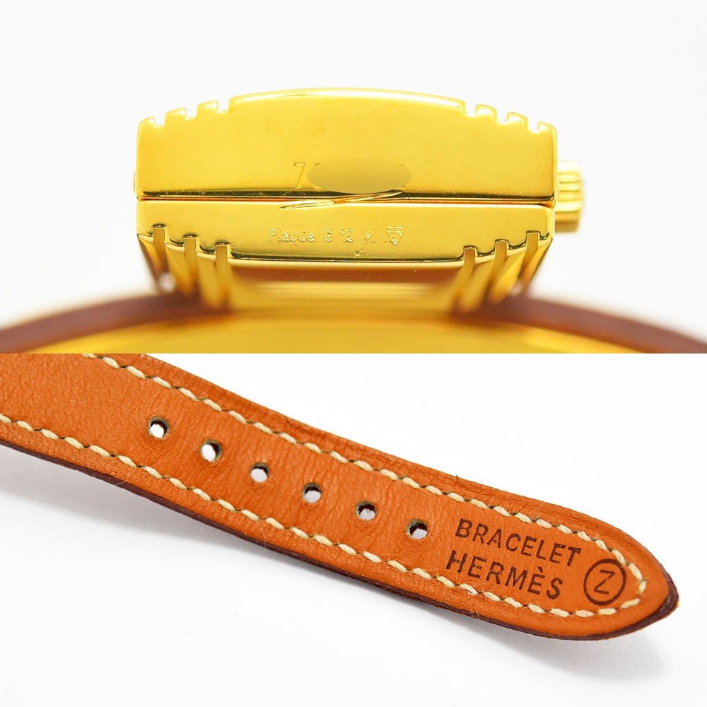 VINTAGE WATCHES FASHIONのエルメス ケリーウォッチ。ゴールドの南京錠型ケースとホワイトステッチ入りブラウンレザーベルトのディテール。