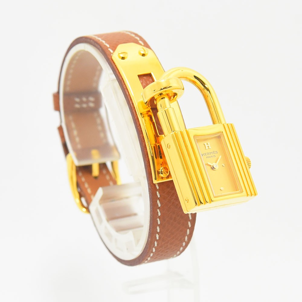 VINTAGE WATCHES FASHIONのエルメス ケリーウォッチ。ゴールドのカデナ型ケースとホワイトステッチが施されたブラウンレザーベルトが特徴のレディース腕時計