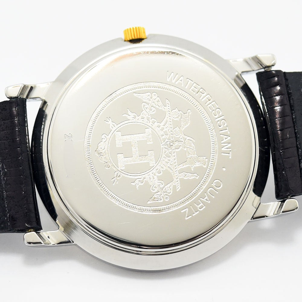 VINTAGE WATCHES FASHIONのエルメスヴィンテージクォーツ腕時計の裏蓋。Hロゴと馬車の刻印があるシルバーケースとブラックレザーベルト。