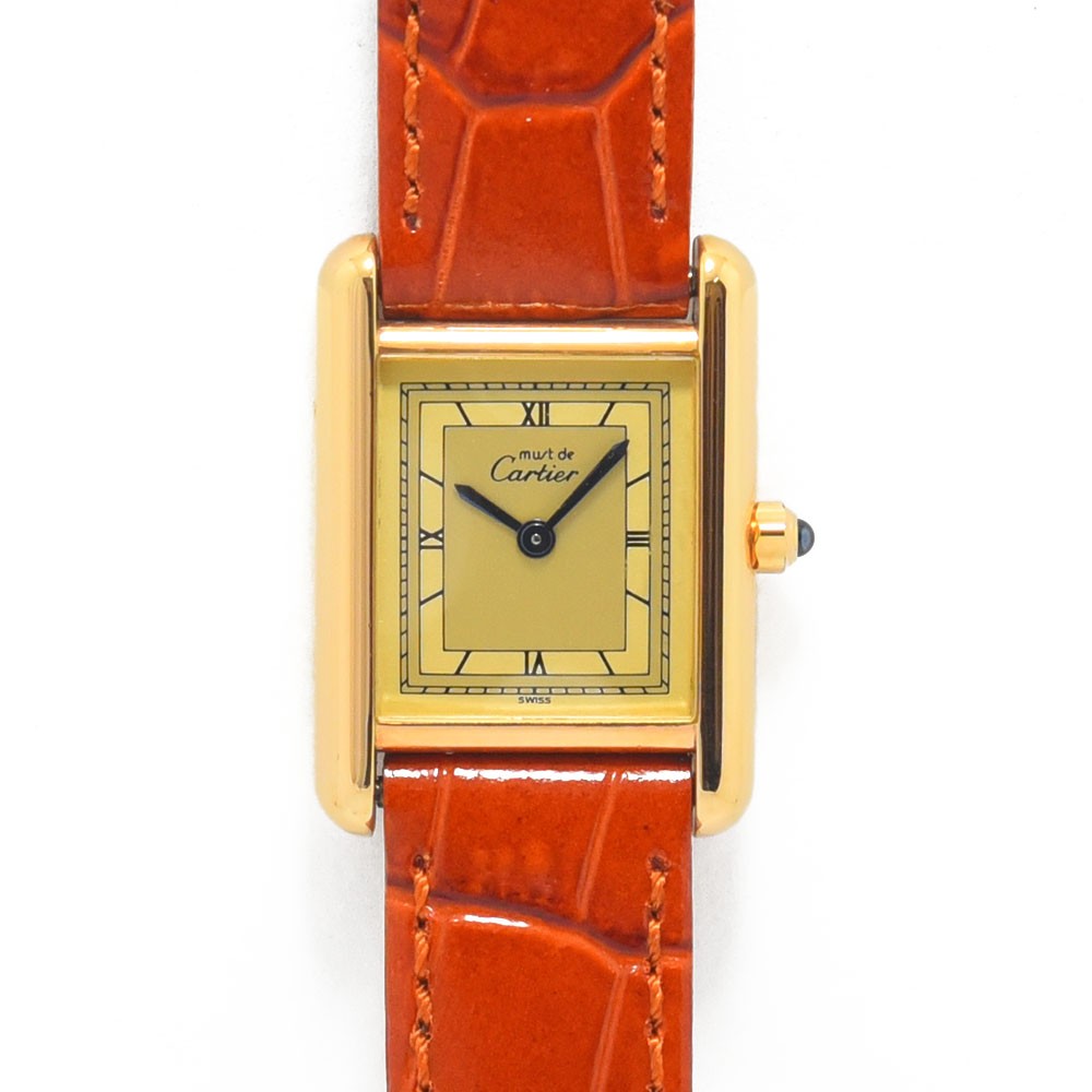 VINTAGE WATCHES FASHIONのMust de Cartier Tankウォッチ、ゴールドトーンケース、クリーム文字盤、ローマ数字、オレンジのアリゲーター型押しレザーストラップ
