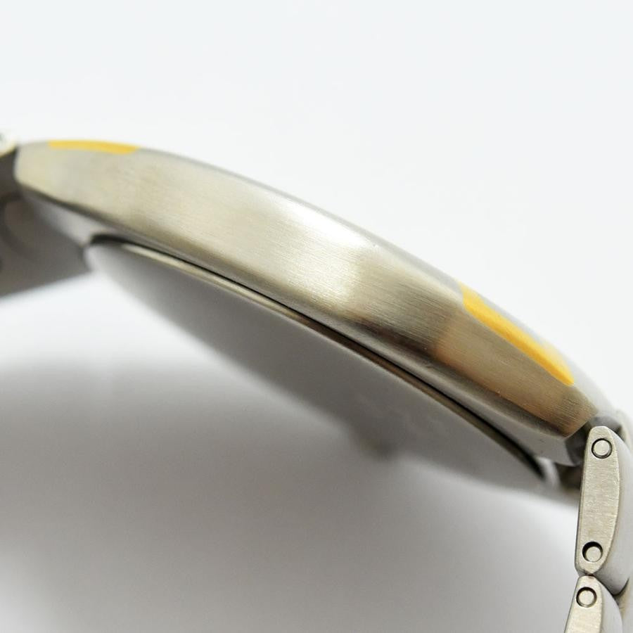 VINTAGE WATCHES FASHION オメガ シーマスター GMT 自動巻き腕時計。鮮やかなイエローとゴールドのアクセント。ステンレススチール製。