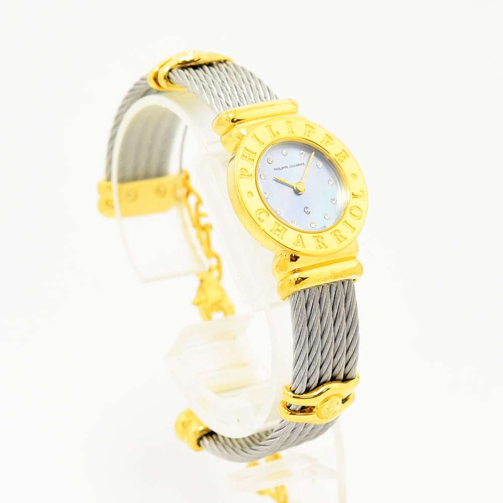 VINTAGE WATCHES FASHIONのフィリップ・シャリオール製レディース腕時計。ゴールドベゼルとワイヤーケーブルブレスレット、マザーオブパールの文字盤が特徴。