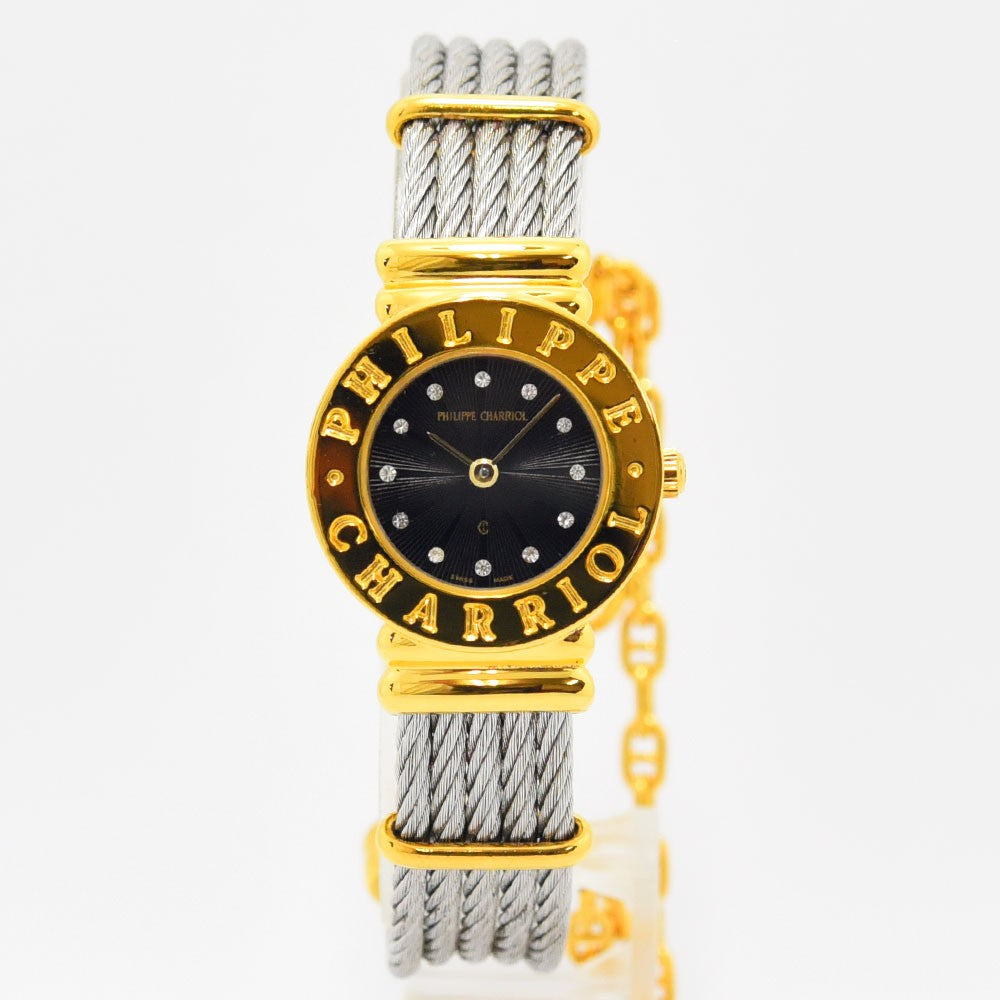 VINTAGE WATCHES FASHIONのフィリップ・シャリオール製レディース腕時計。ゴールドベゼルとシルバーのワイヤーケーブルブレスレット、ストーン付きブラック文字盤が特徴。