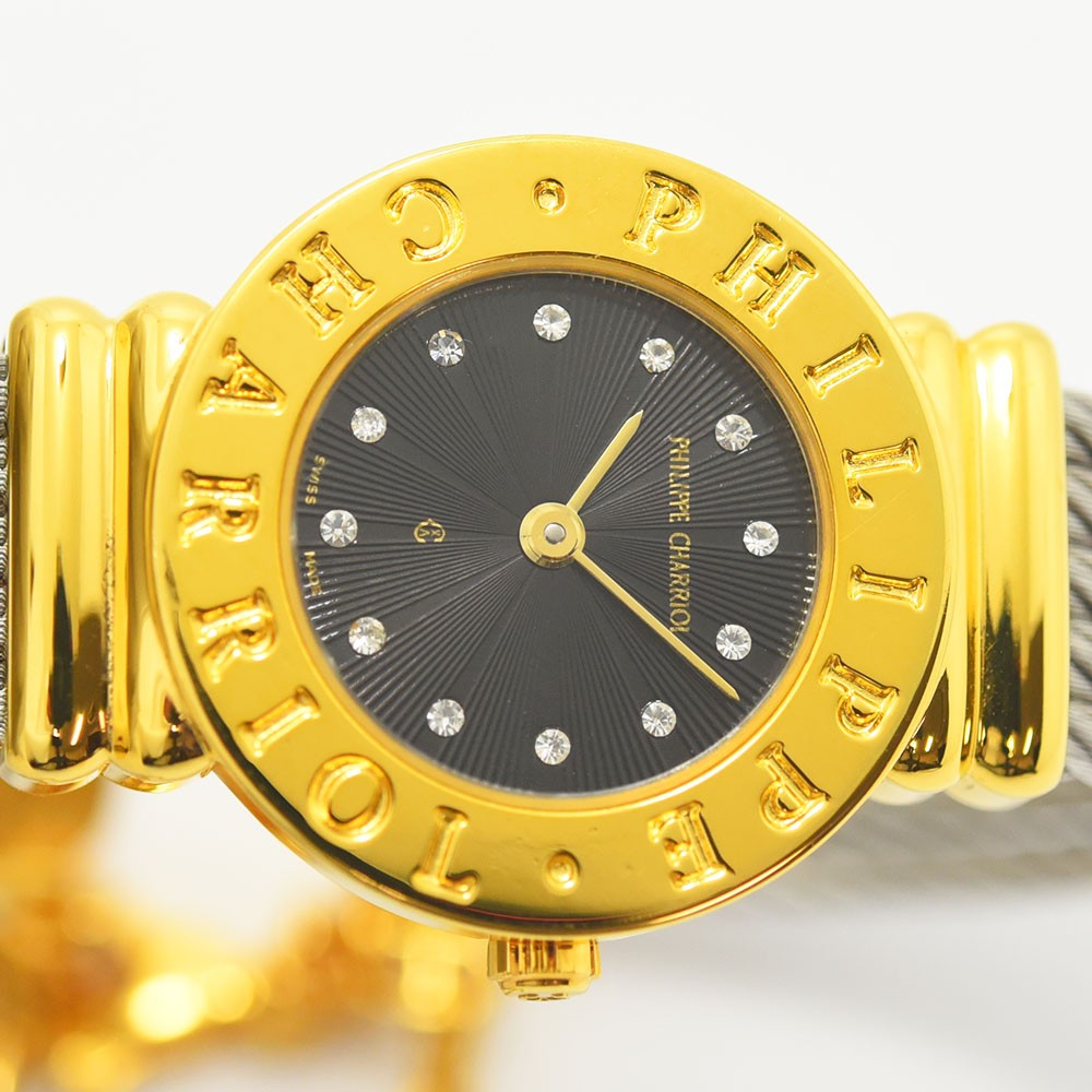 VINTAGE WATCHES FASHIONのフィリップ・シャリオール製レディース腕時計。ゴールドベゼルとブラックの文字盤にストーンが輝くエレガントなデザイン。