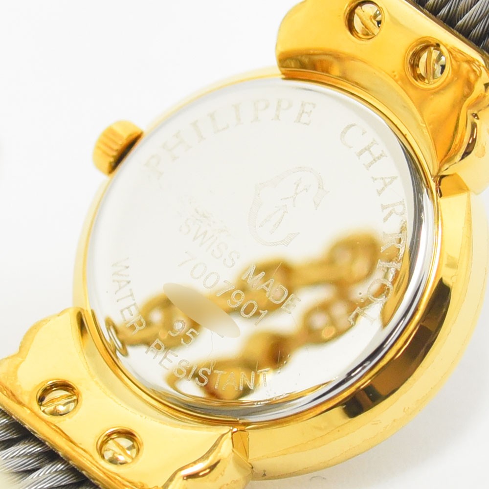 VINTAGE WATCHES FASHIONのフィリップ・シャリオールレディース腕時計の裏蓋。ゴールドカラーのケースと特徴的なワイヤーケーブルブレスレットの接合部が見える。