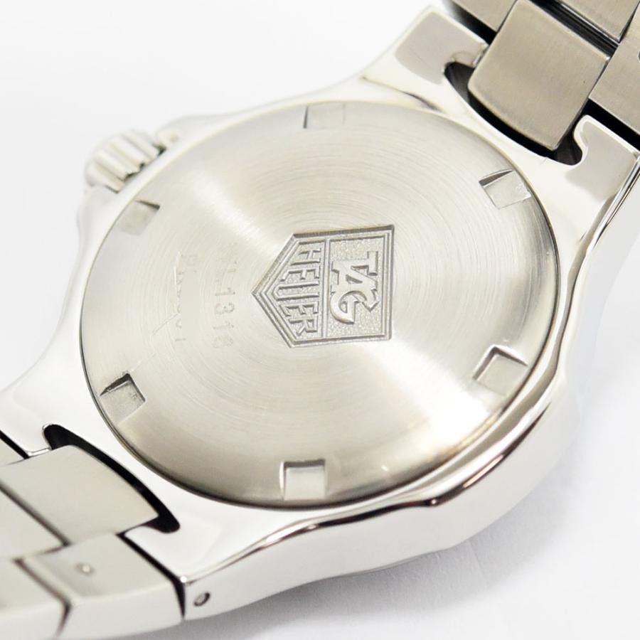 VINTAGE WATCHES FASHIONのタグ・ホイヤー プロフェッショナル腕時計のステンレス製ケースバック。ブランドロゴが刻印されたシルバーの裏蓋